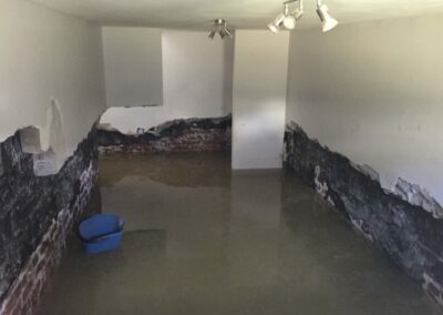 Flooded cellar with floating bucket