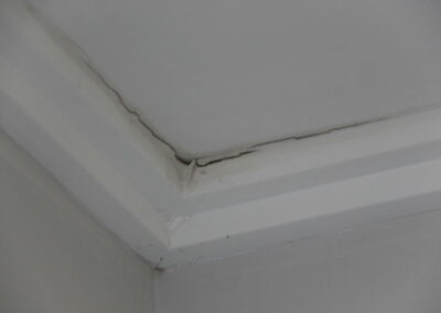 Cracked garage ceiling from water ingress in eco build disaster