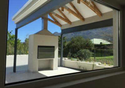 Through the piano window to the patio and beyond