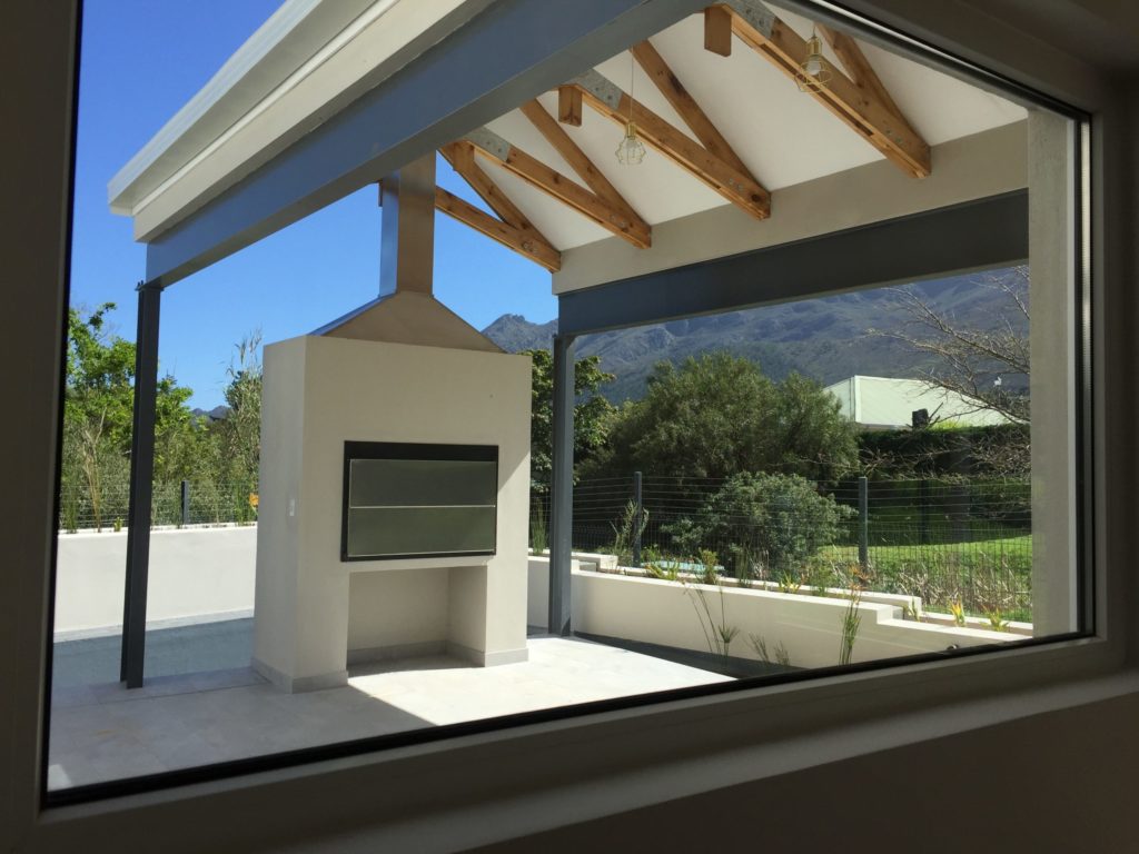 Through the piano window to the patio and beyond