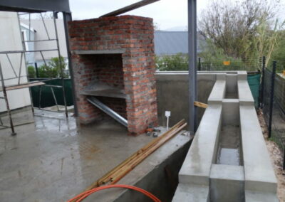 Building the reed beds - builder built over the building line