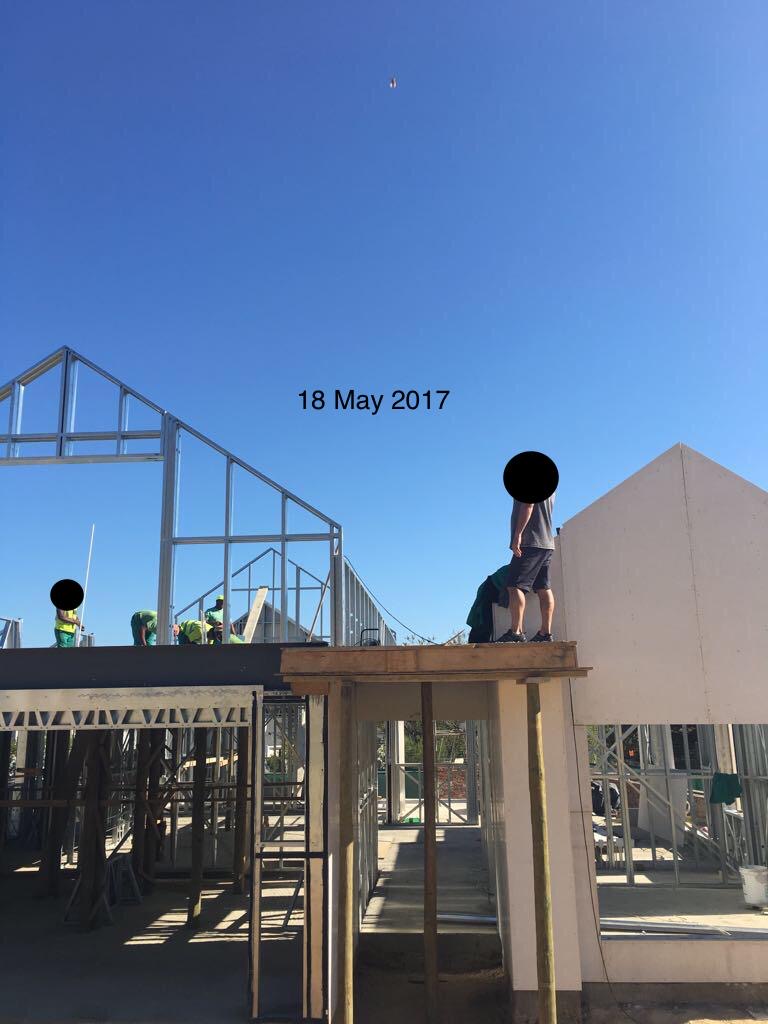 Developer's master builder supervising the upper storey
